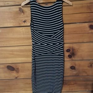 Form-fitting black and white striped sleeveless dress
